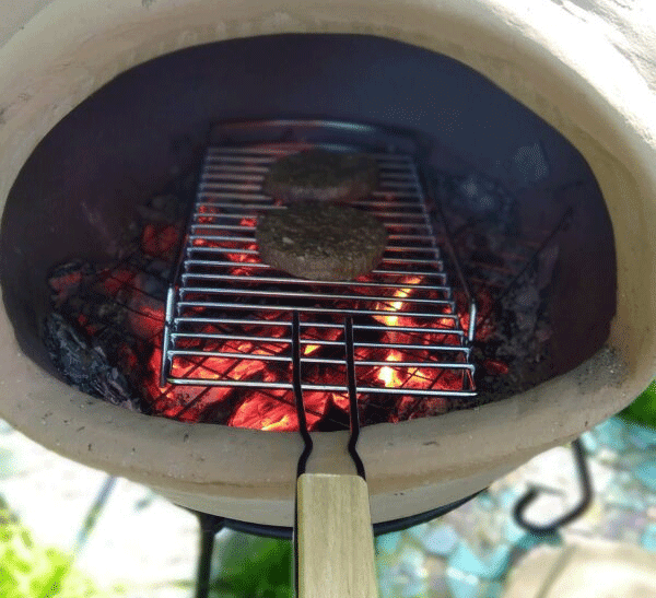chiminea cooking - Twi veggie burgers on a grill